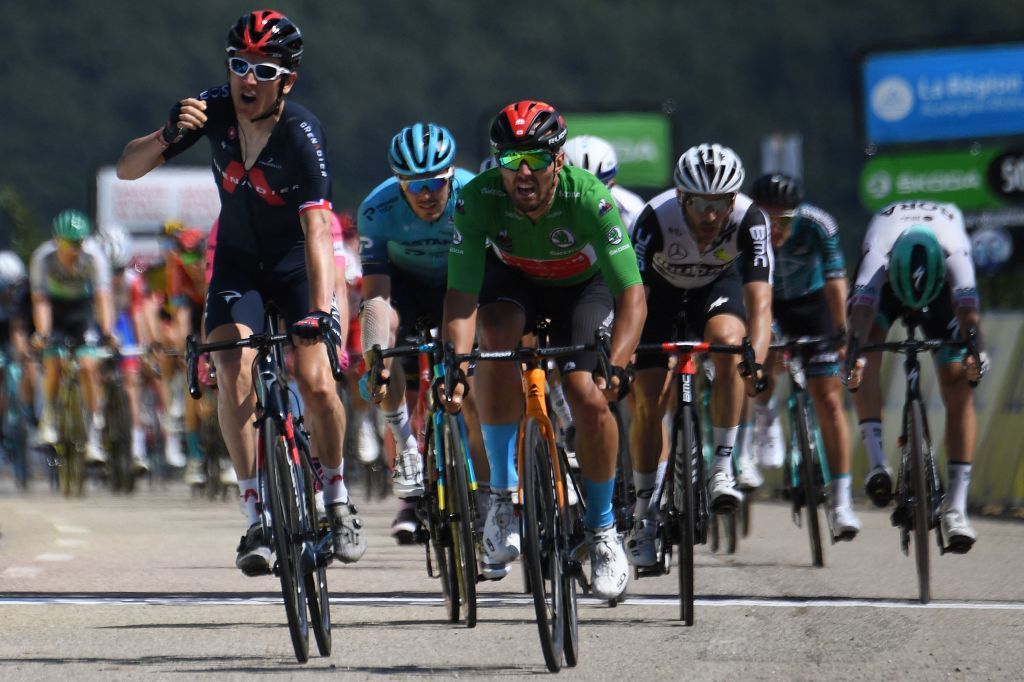 Team Ineos Geraint Thomas of Great Britain L celebrates as he crosses the finish line ahead of Team Bahrains Sonny Colbrelli of Italy wearing the best sprinters green jersey at the end of the during the fifth stage of the 73rd edition of the Criterium du Dauphine cycling race a 175km between SaintChamond and SaintVallier on June 3 2021 Photo by Alain JOCARD AFP Photo by ALAIN JOCARDAFP via Getty Images