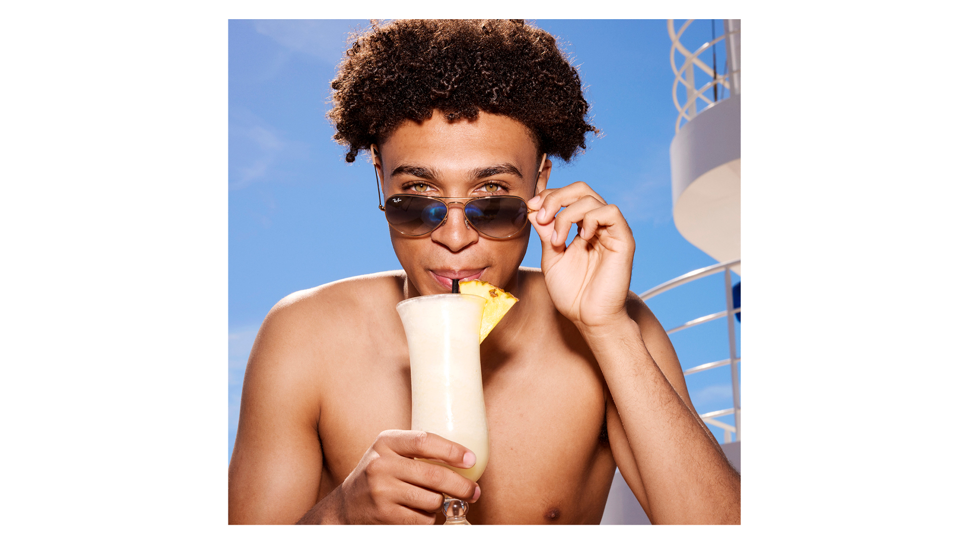 Photograph of a male model sipping a cocktail, taken by British photographer Rankin as part of a creative collaboration with cruise line operator P&amp;amp;O Cruises titled On Board with Rankin