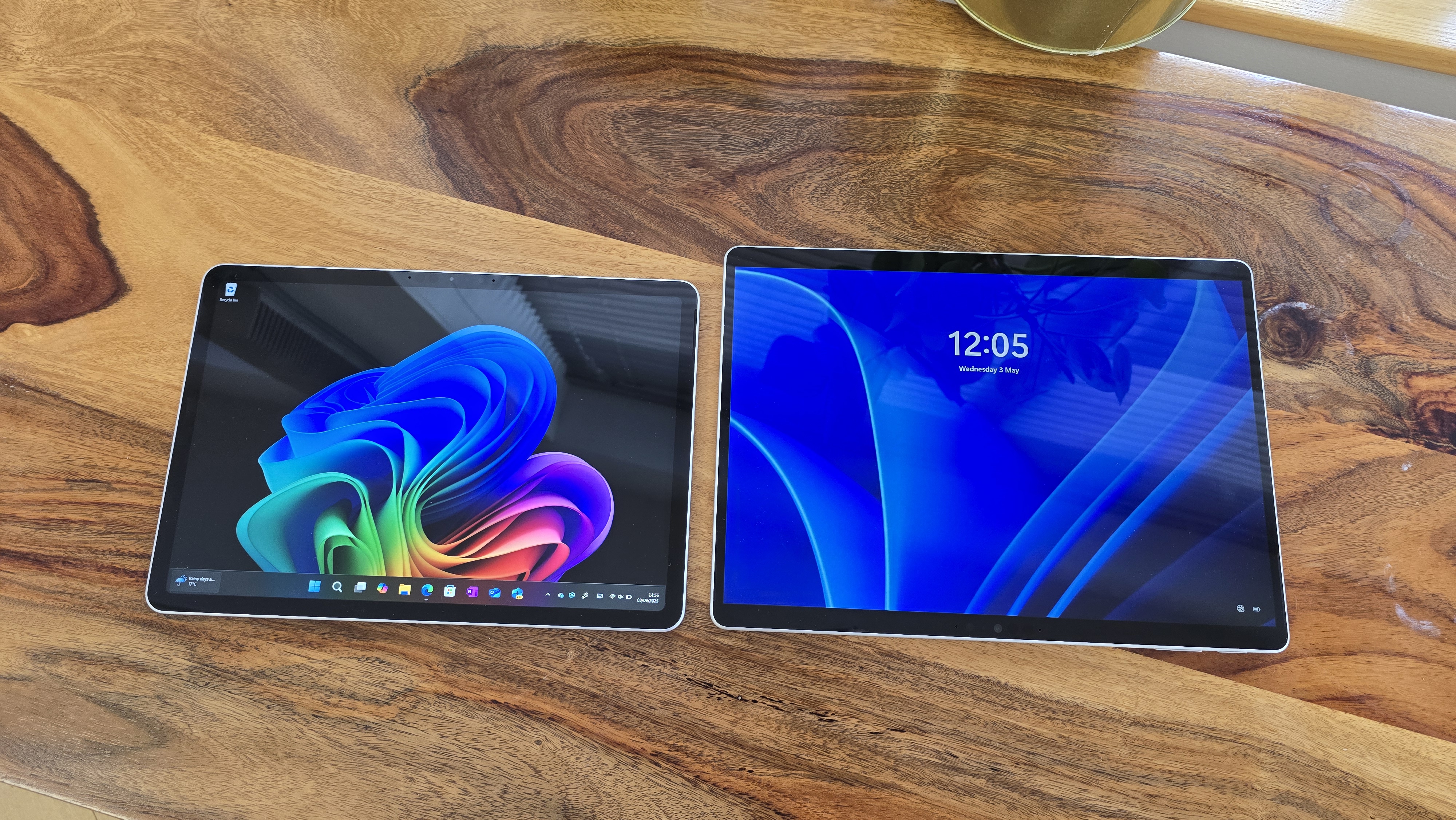 Microsoft Surface Pro 12 tablet on wooden table in relaxed cafe