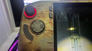 MSI Claw x Fallout handheld gaming PC, closeup of the RGB lighting and rust effect near the joysticks