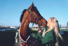 2025 Randox Grand National winner Nick Rockett with his groom Katie Walton.