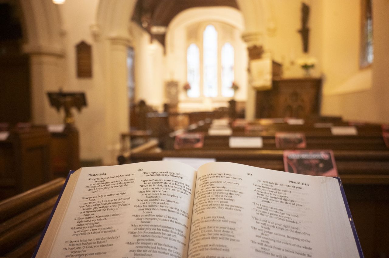 Viltrox AF 28mm F4.5 image gallery: inside an old church, with an open bible on a pew