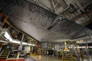 Endeavour's underbelly (with deployed landing gear) is covered with more than 20,000 thermal protection system tiles that shielded the orbiter from the heat generated during reentry into the Earth's atmosphere.