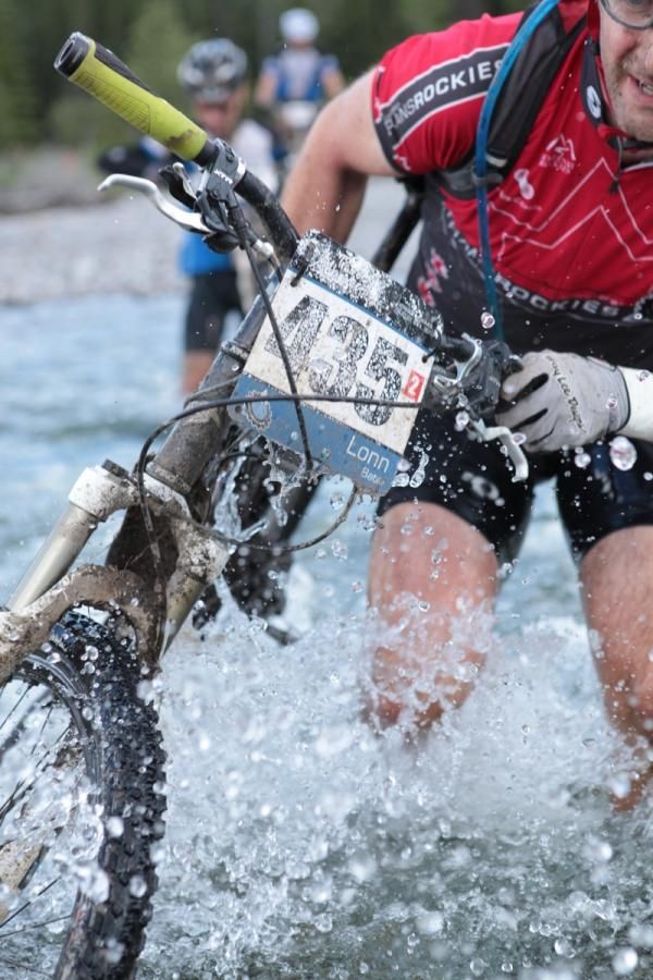 Lonn Bate of SchmoeGoatRacing fights through the glacially cold Elbow River.