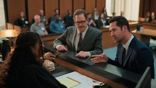 Regina, William, and Mickey discuss matters privately in a courtroom in The Lincoln Lawyer season 3