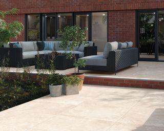 split level patio with seating area and planting