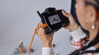 Close Up of Young Black Woman Holding Camera