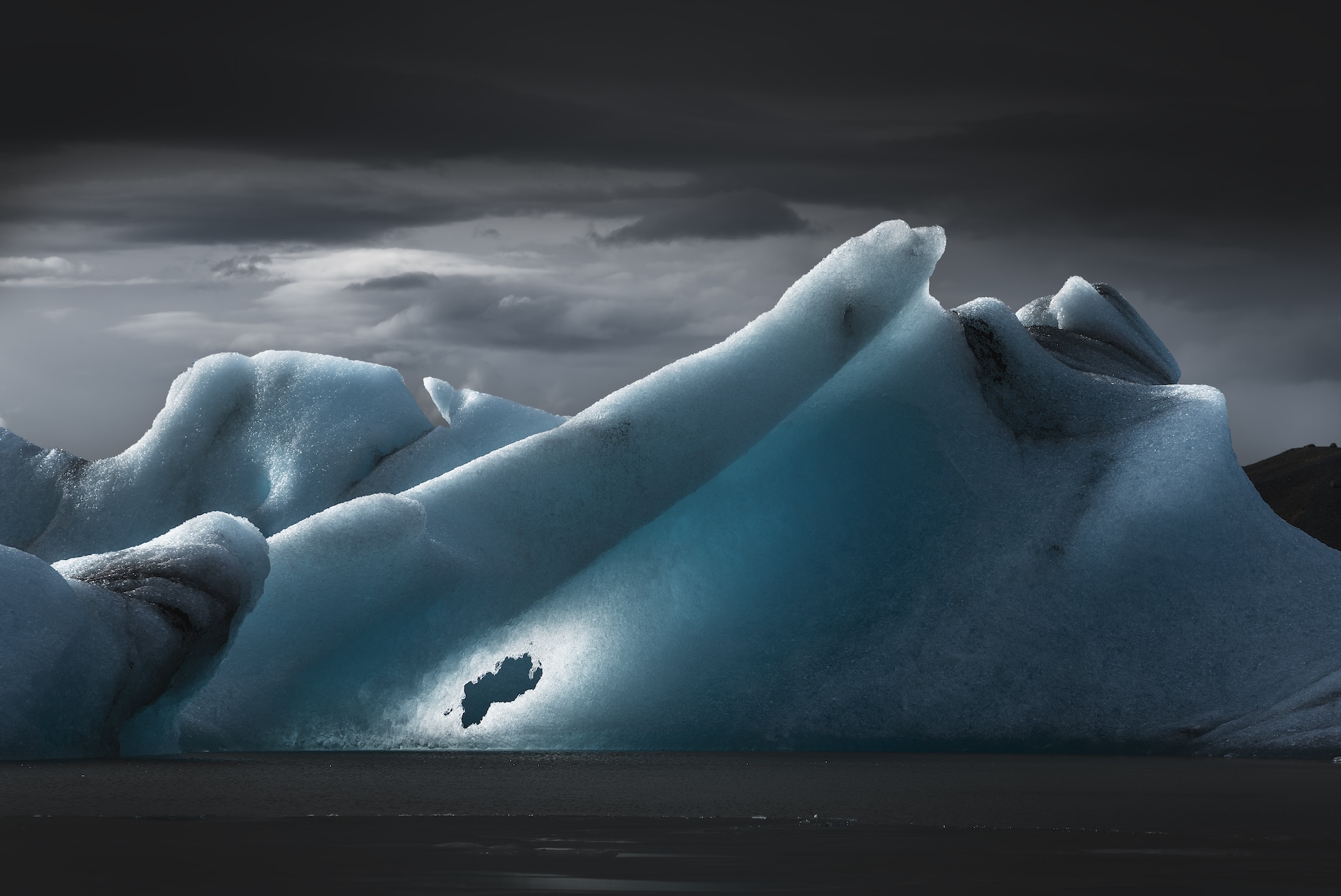 A dramatically lit photo of a glacier