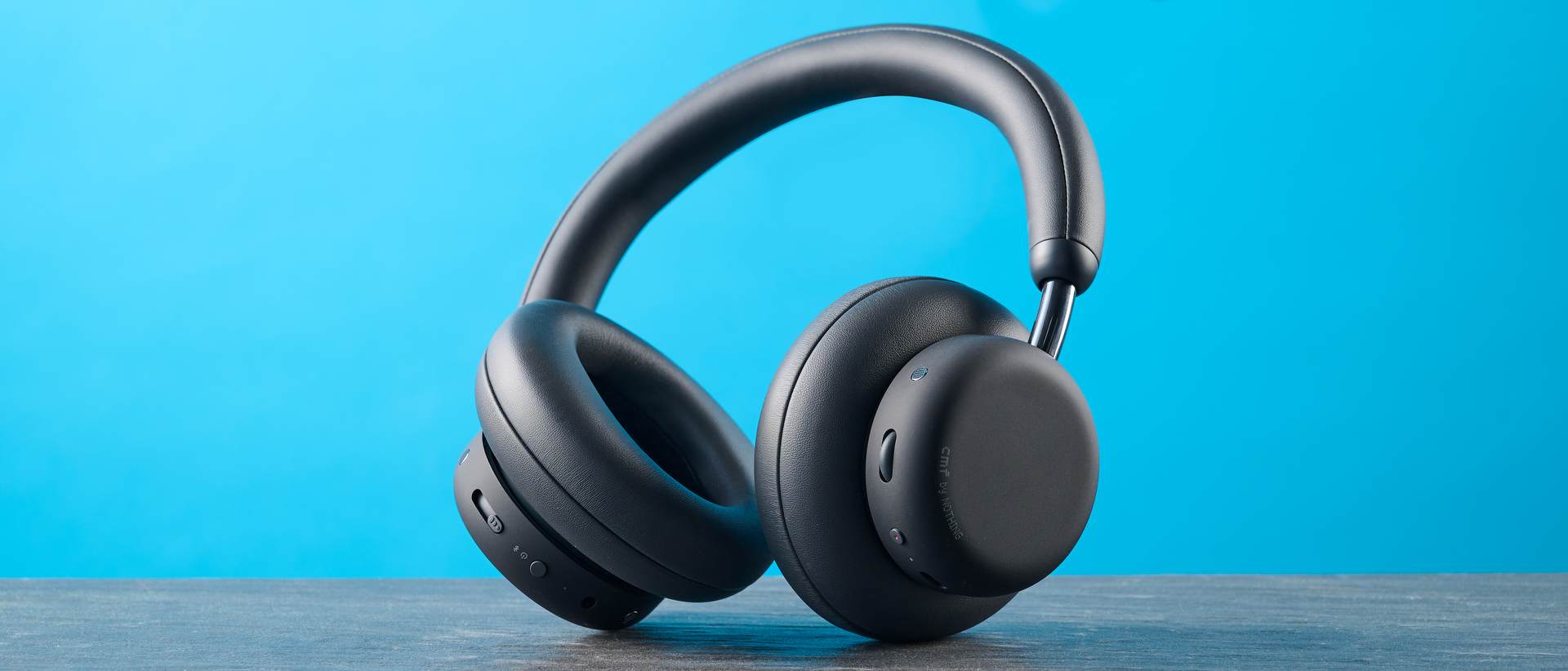 the cmf headphone pro / cmf by nothing headphone pro / nothing headphone pro in black photographed against a blue tom's guide background