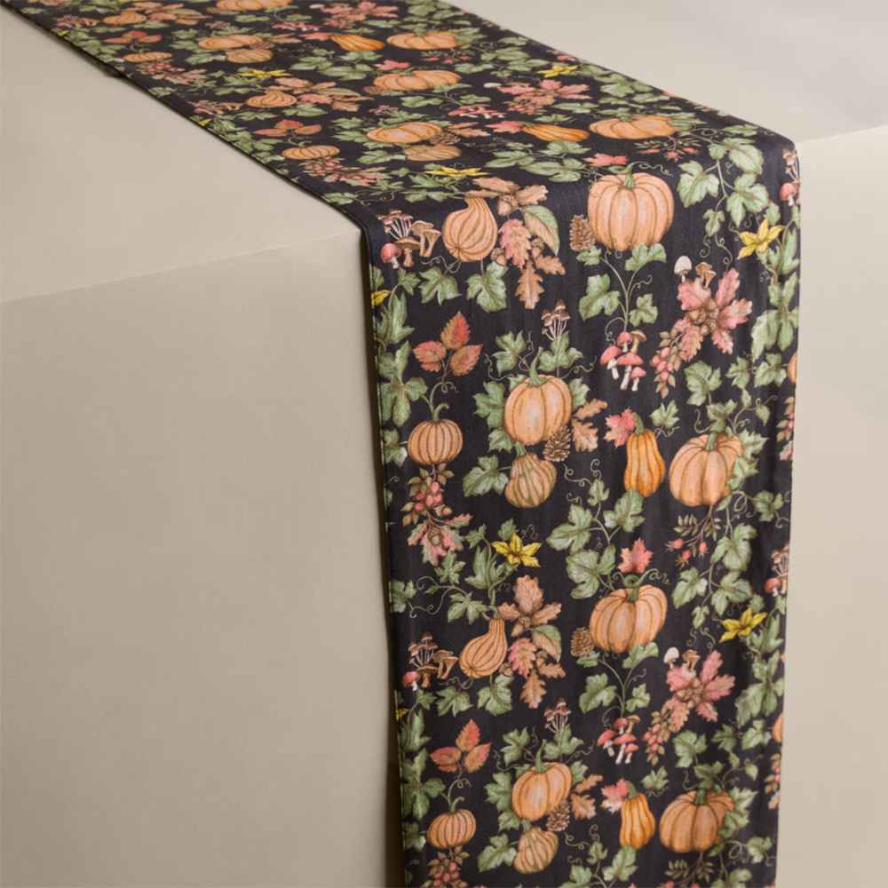 Brown table runner with pumpkin patch illustrations
