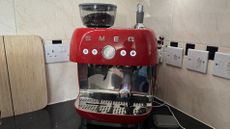 Smeg Espresso Coffee Machine EGF03 placed on a kitchen counter