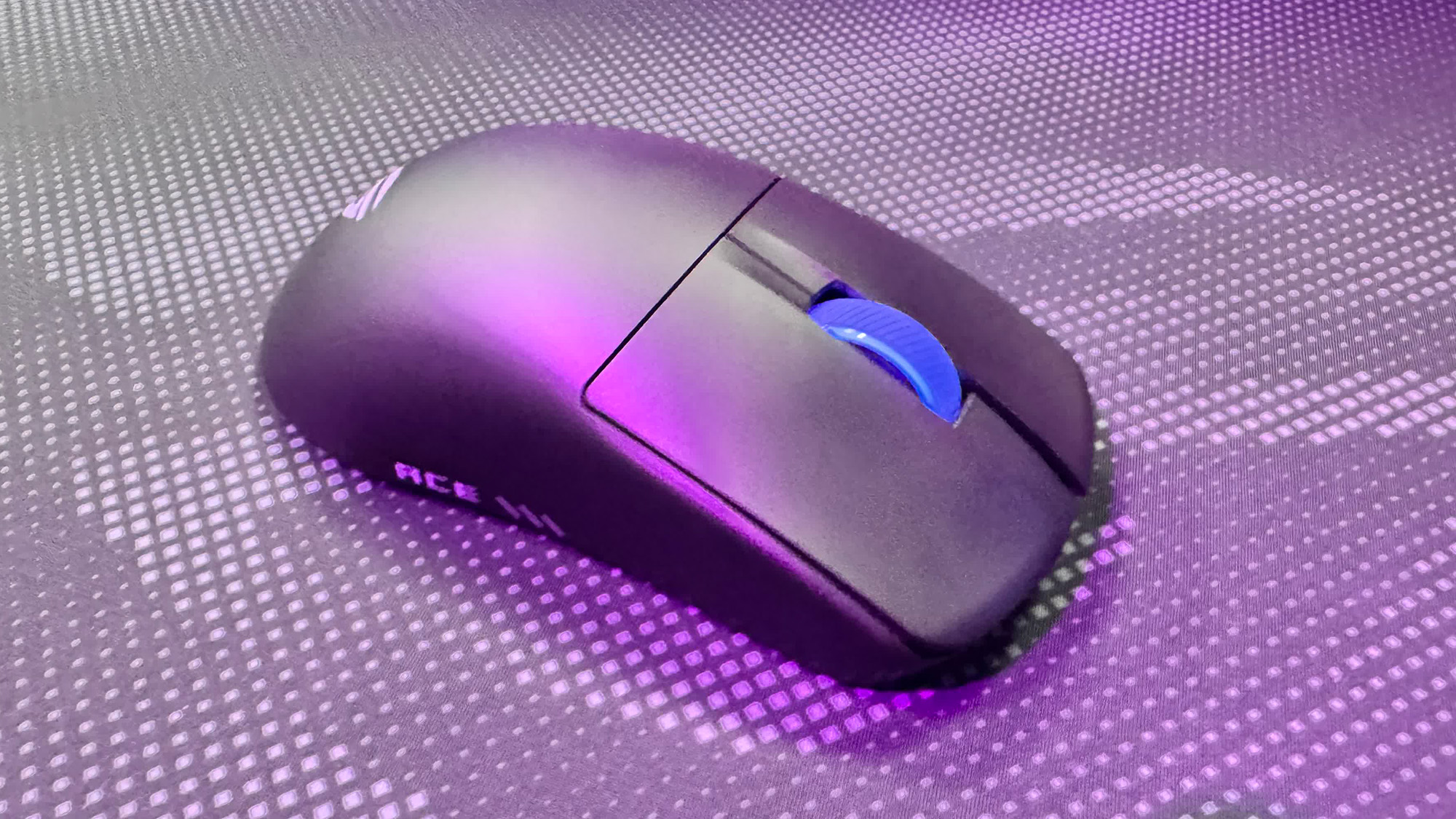 Asus ROG Harpe II Ace gaming mouse on a mousepad at Computex 2025.
