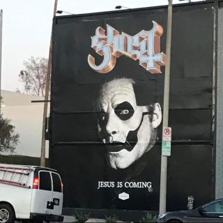 Ghost on a billboard with the words ‘Jesus Is Coming’