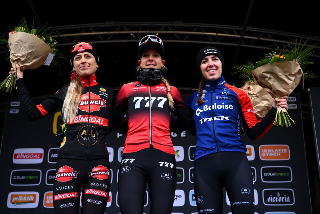 BOOM BELGIUM DECEMBER 03 LR Denise Betsema of The Netherlands and Team Pauwels Sauzen Bingoal on second place race winner Aniek Van Alphen of The Netherlands and Team 777 and Shirin Van Anrooij of The Netherlands and Team Baloise Trek Lions on third place pose on the podium ceremony after the 7th Superprestige Cyclocross Boom 2022 Womens Elite Superprestige2023 on December 03 2022 in Boom Belgium Photo by Luc ClaessenGetty Images
