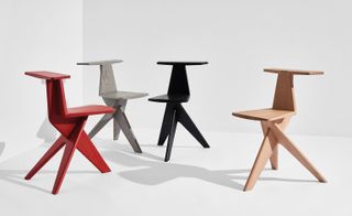 Different coloured wooden chairs