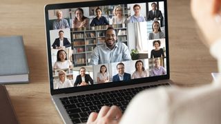 Person on video call with colleagues