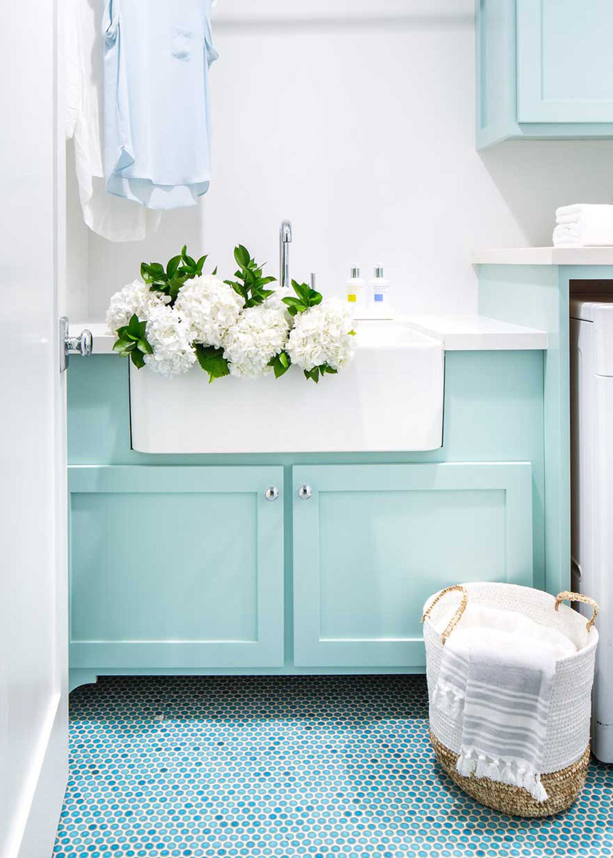 mint green laundry room with turquoise mosaic floor tiles