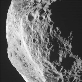 This side view taken by NASA's Cassini spacecraft of Saturn's moon Hyperion reveals craters and other battered surface features. This photo was taken during Cassini's Aug. 25, 2011 flyby of Hyperion.