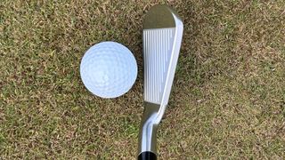 Photo of the Srixon ZXi5 Iron behind the ball