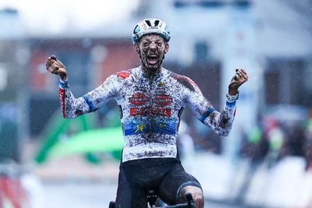 Belgian rider Michael Vanthourenhout celebrates as he crosses the finish line to win the mens elite race of the Belgian national cyclocross championships in Lokeren on January 15 2023