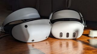 A PlayStation VR2 next to a Meta Quest 3 VR headset
