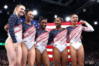 Jade Carey, Sunisa Lee, Simone Biles, Jordan Chiles and Hezly Rivera of Team United States celebrate winning gold during the Artistic Gymnastics Women's Team Final at the Olympic Games Paris 2024.