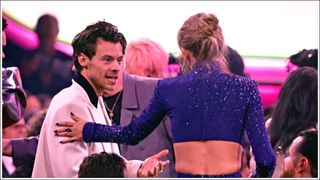 Harry Styles and Taylor Swift speak during the 65th GRAMMY Awards at Crypto.com Arena on February 05, 2023 in Los Angeles, California