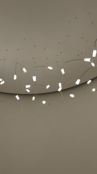 small lights hanging from a white ceiling