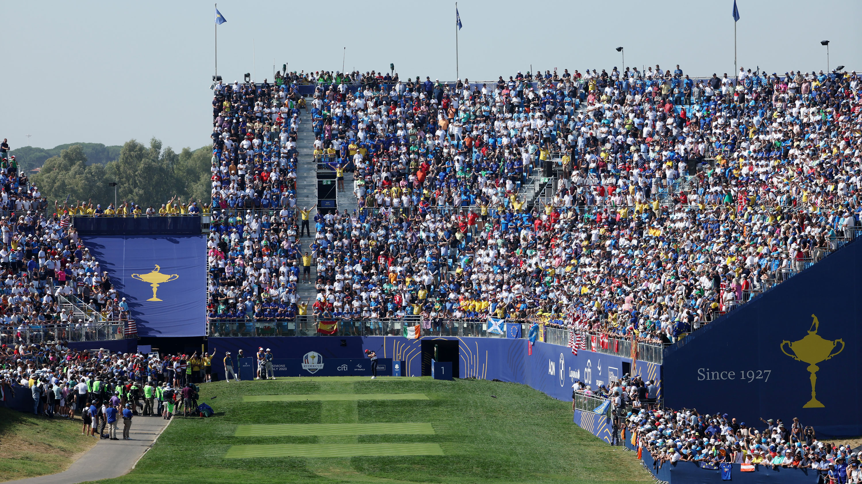 massive crowds in the grandstand behind the Ryder Cup first tee