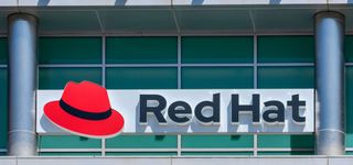 Red Hat logo and sign on open source software company office in Silicon Valley
