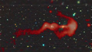 a red wisp of gas on a starry background