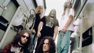 Cannibal Corpse posing for photographs in an industrial estate in 1996