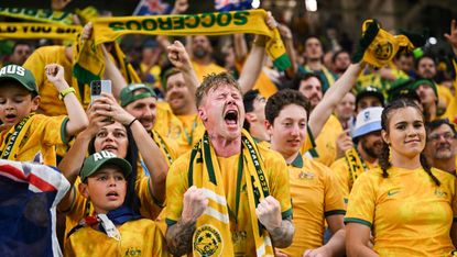 Australia fans celebrate winning their final group game 