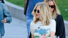 meg ryan wearing a printed tshirt and sunglasses