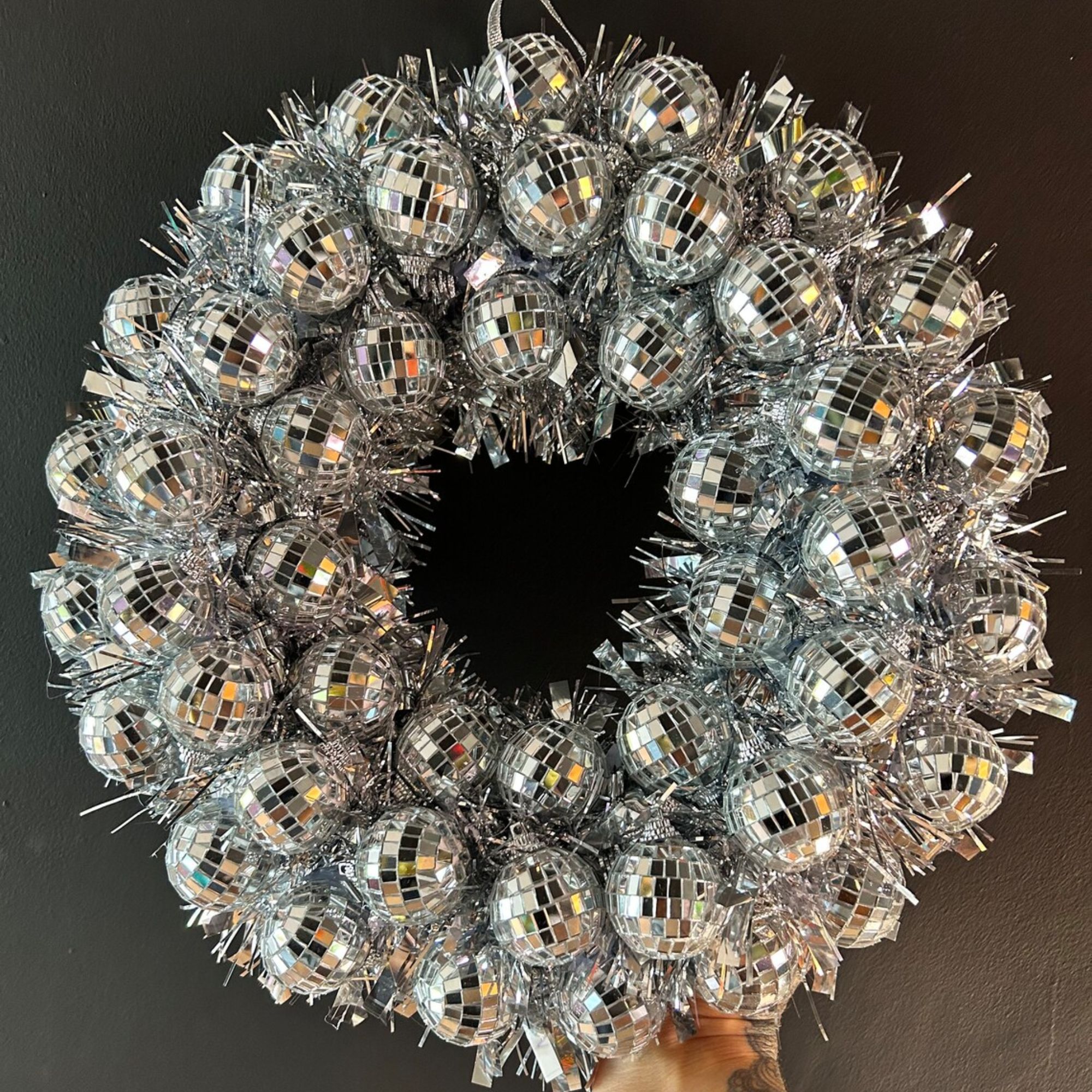 A Christmas wreath crafted from disco ball baubles