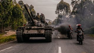 Tanks rolling as motorbikes pass, from the Sony World Photography Awards 2023