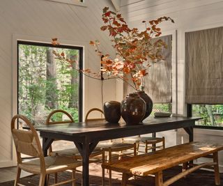 dining room in cabin with white painted wood walls