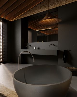 concrete bathtub in gray bathroom