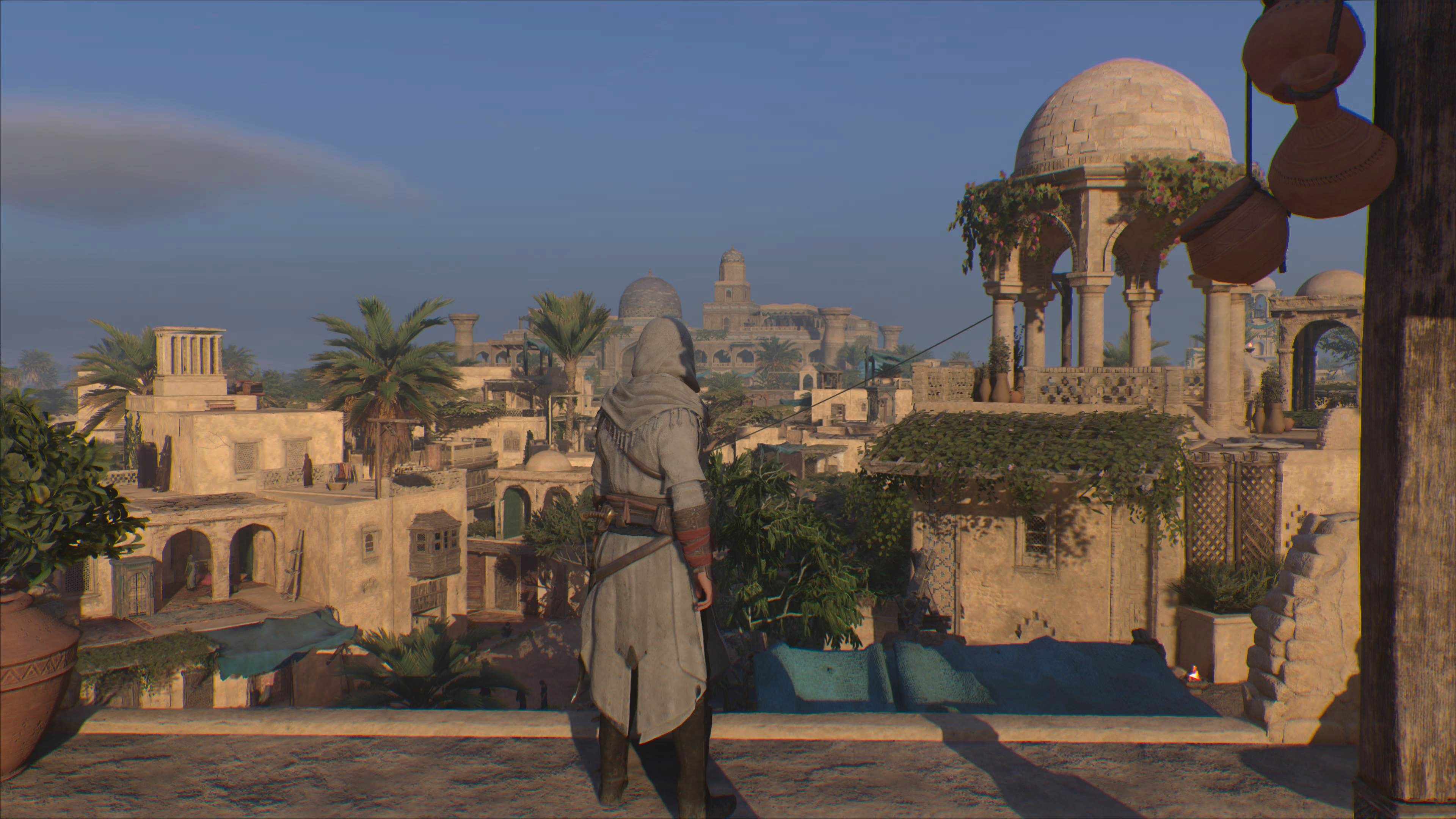 Screenshot van Basim en de skyline van Bagdad in Assassin's Creed Mirage