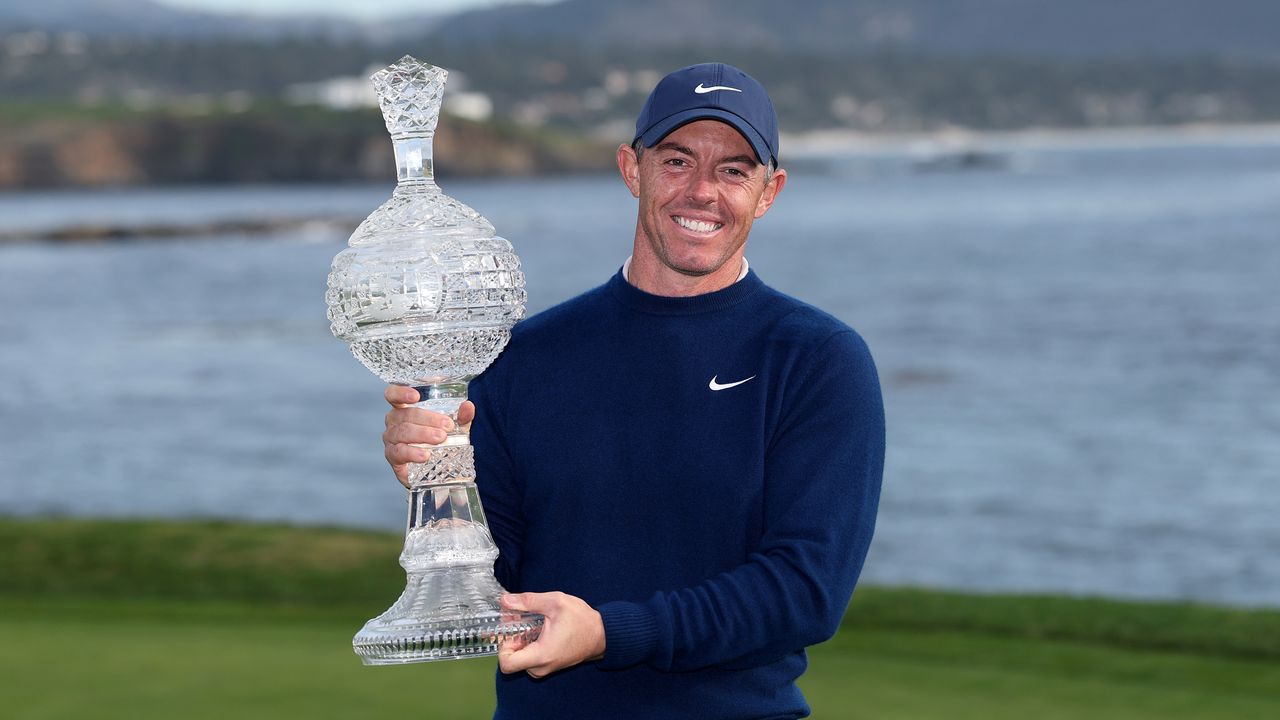 Rory McIlroy holds up the 2025 AT&amp;T Pebble Beach Pro-Am trophy