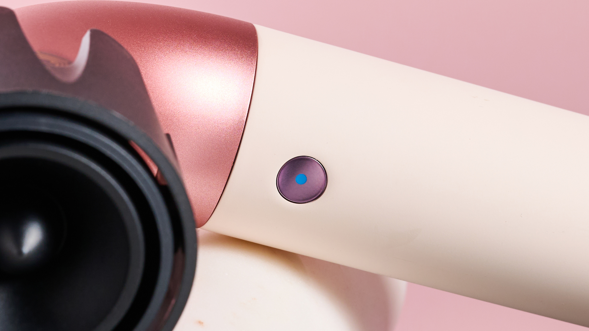 Close up of cool shot button on Dyson Supersonic r hair dryer