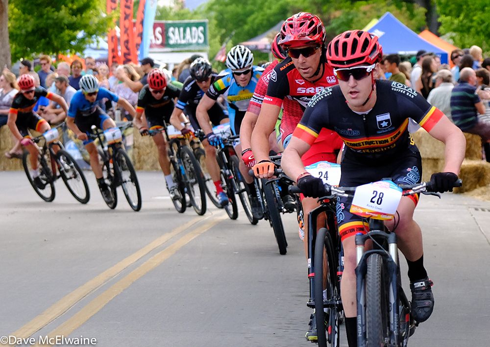 Ricky Creel (CZ Racing) leads a large group that includes Todd Wells through the final turn on the course