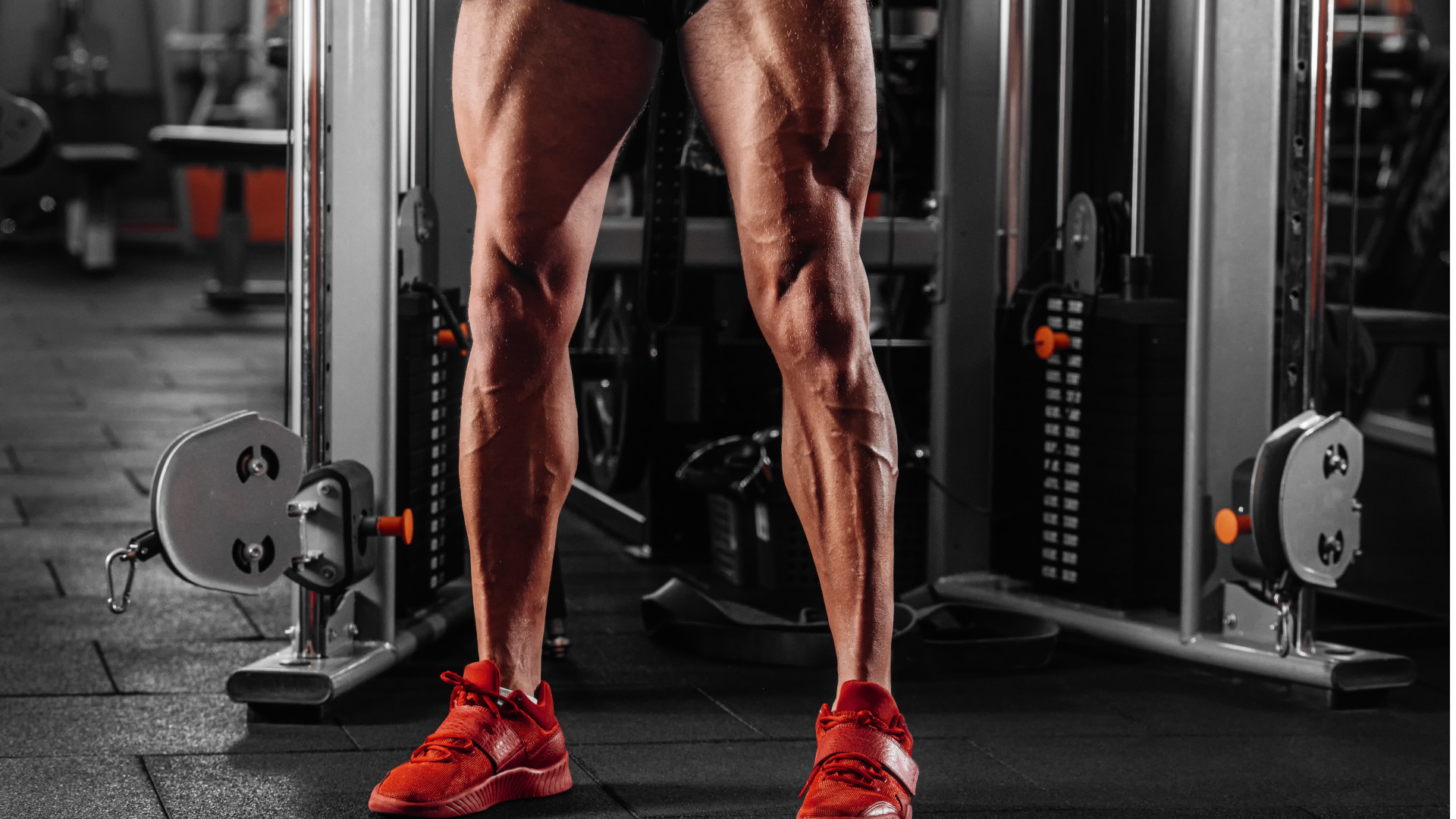 A man standing in the gym with muscular quads