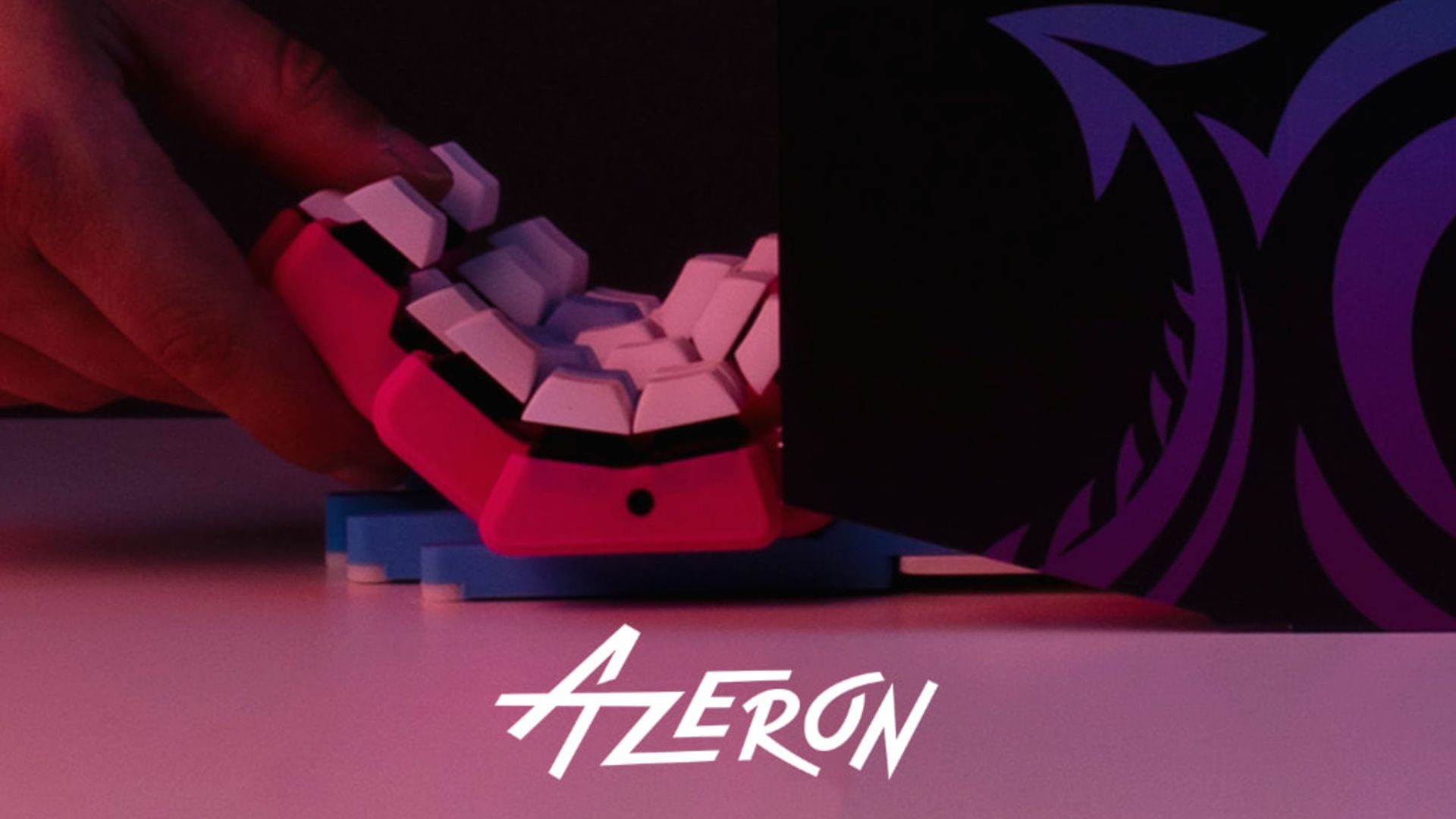 An Azeron teaser image showing a new device being pulled out of its box