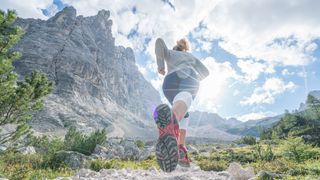 Woman running in trail shoes