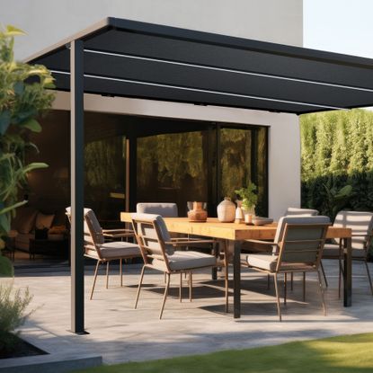 black pergola attached to a white house with concrete patio and dining tables and chairs