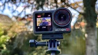 The DJI Osmo Action 5 Pro against an outdoors background