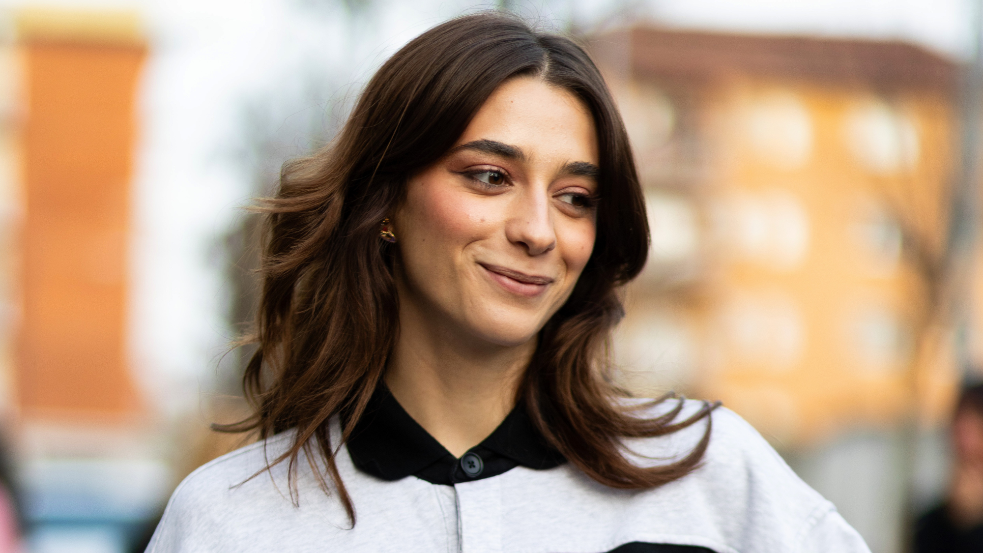 brunette woman with a bouncy blow dry