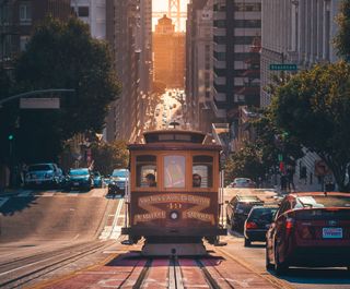 tram next to a row of taxis