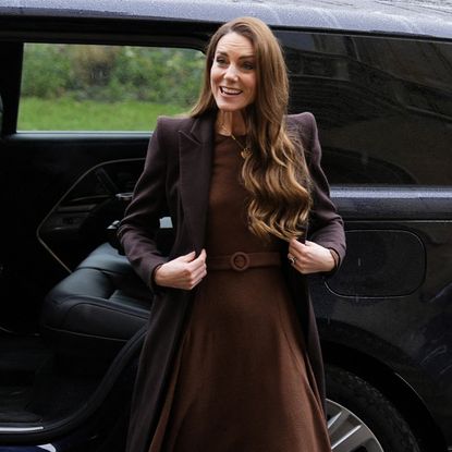 Princess Kate wears a brown satin dress.